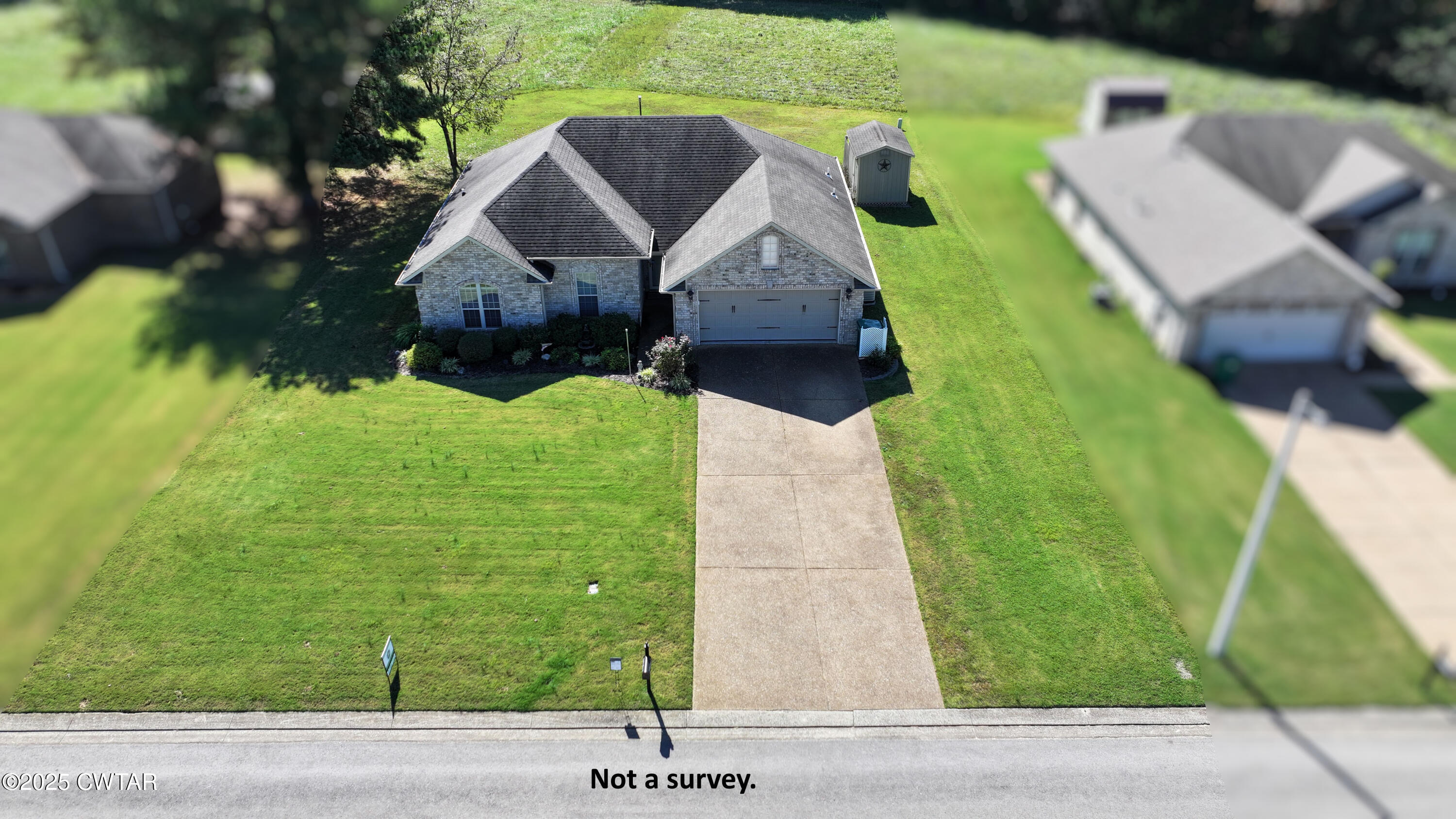 5111 Rolling Meadow Milan, TN 38358 - Photo 31 of 36 a aerial view of a house with a yard