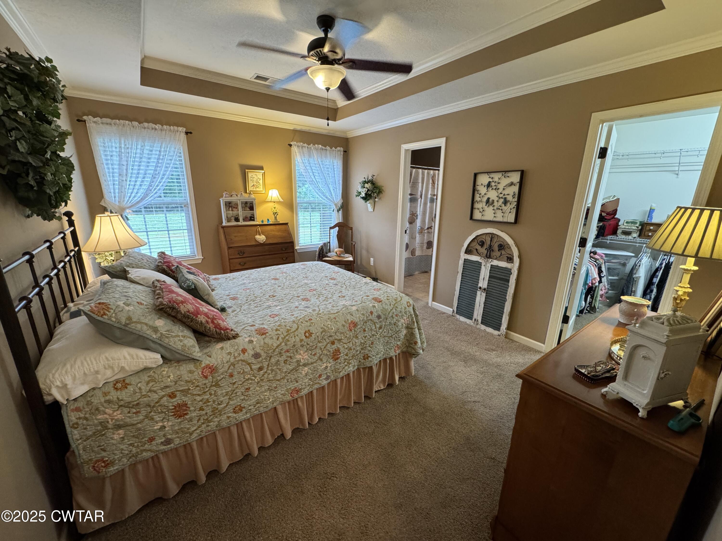 5111 Rolling Meadow Milan, TN 38358 - Photo 5 of 36 a bedroom with a bed and wooden floor