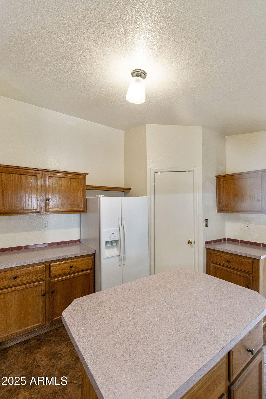 3700 South Tomahawk Road, Unit 80 Apache Junction, AZ 85119 - Photo 13 of 41 a kitchen with a refrigerator and a stove top oven