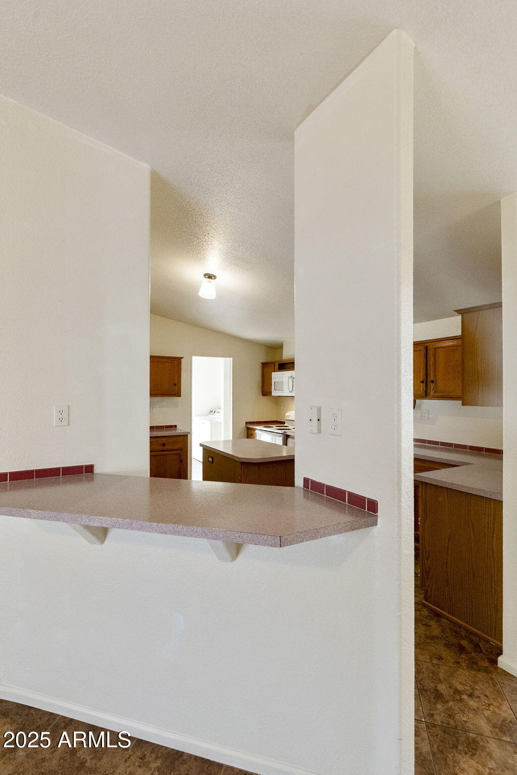 3700 South Tomahawk Road, Unit 80 Apache Junction, AZ 85119 - Photo 14 of 41 a view of kitchen and refrigerator