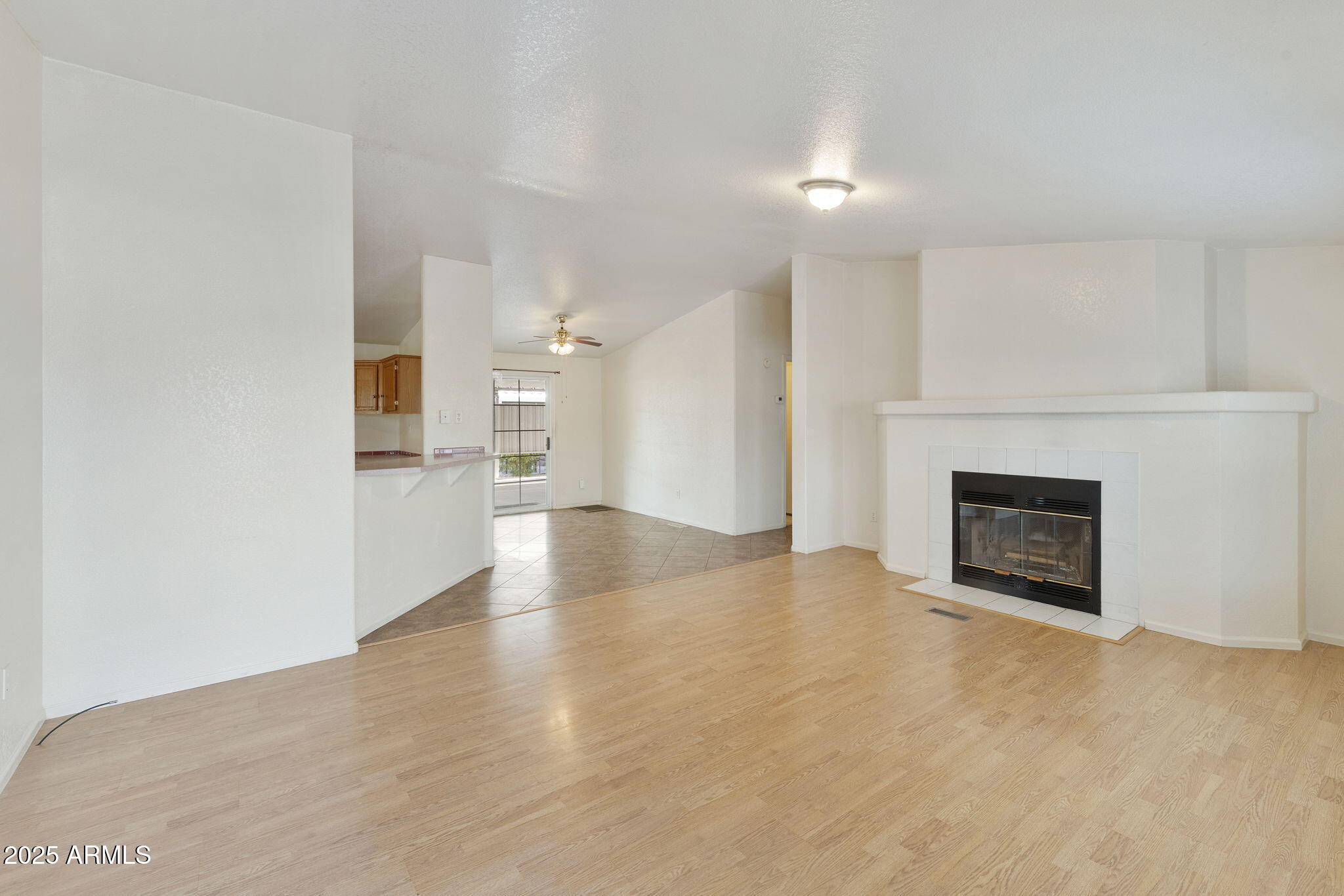 3700 South Tomahawk Road, Unit 80 Apache Junction, AZ 85119 - Photo 17 of 41 a view of a room wooden floor and a fireplace