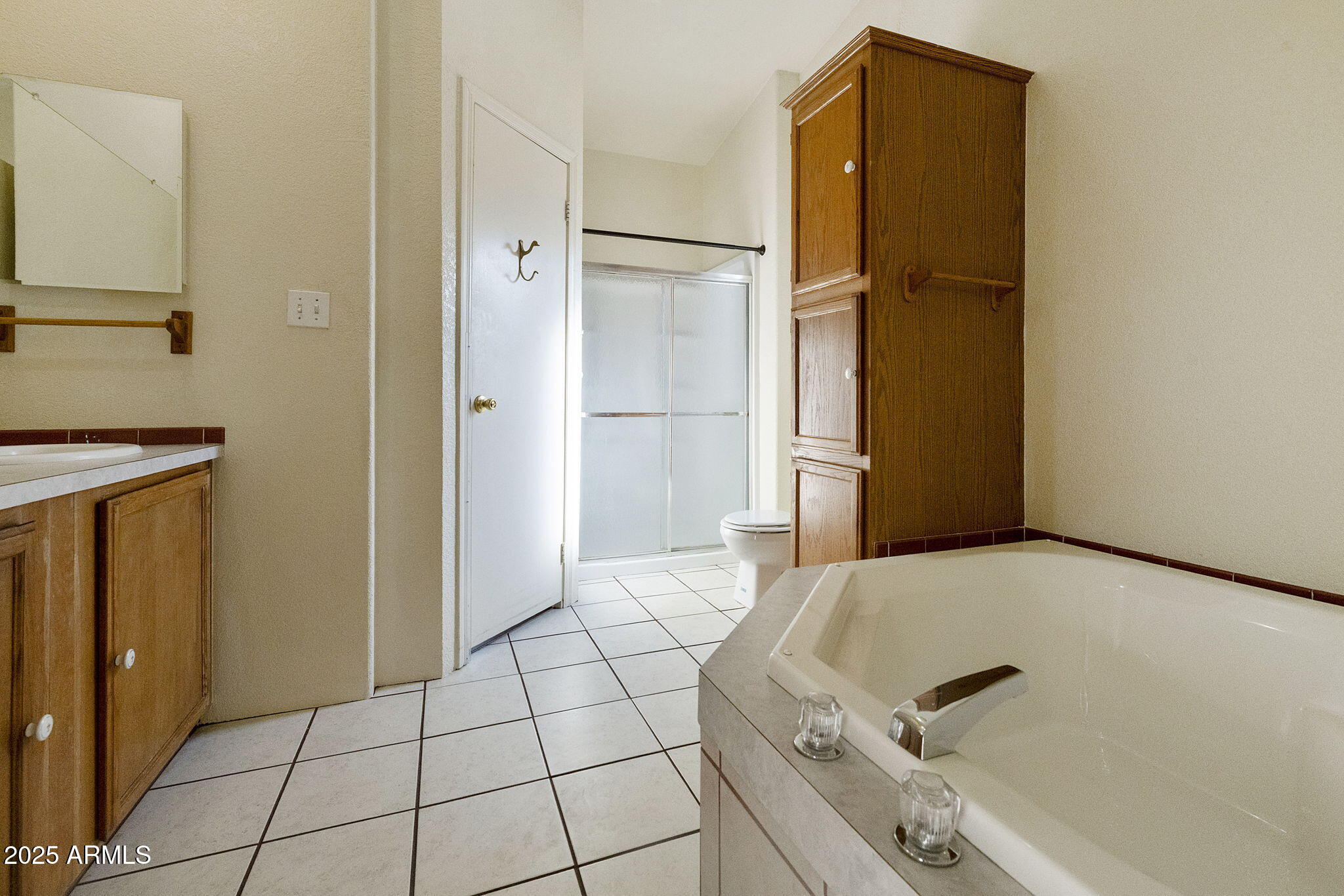 3700 South Tomahawk Road, Unit 80 Apache Junction, AZ 85119 - Photo 20 of 41 a bathroom with a bathtub and a shower