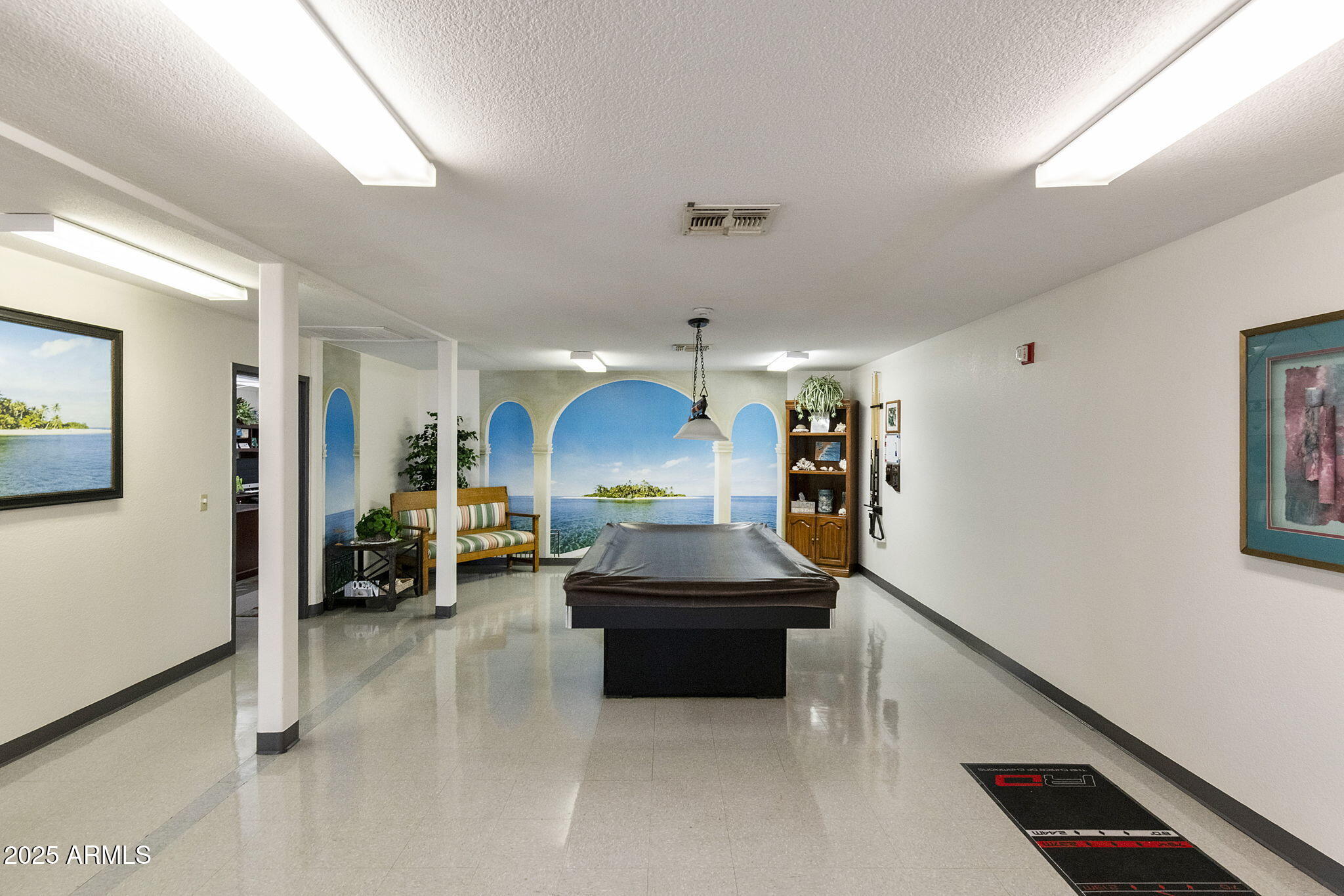 3700 South Tomahawk Road, Unit 80 Apache Junction, AZ 85119 - Photo 31 of 41 a living room with furniture and a chandelier