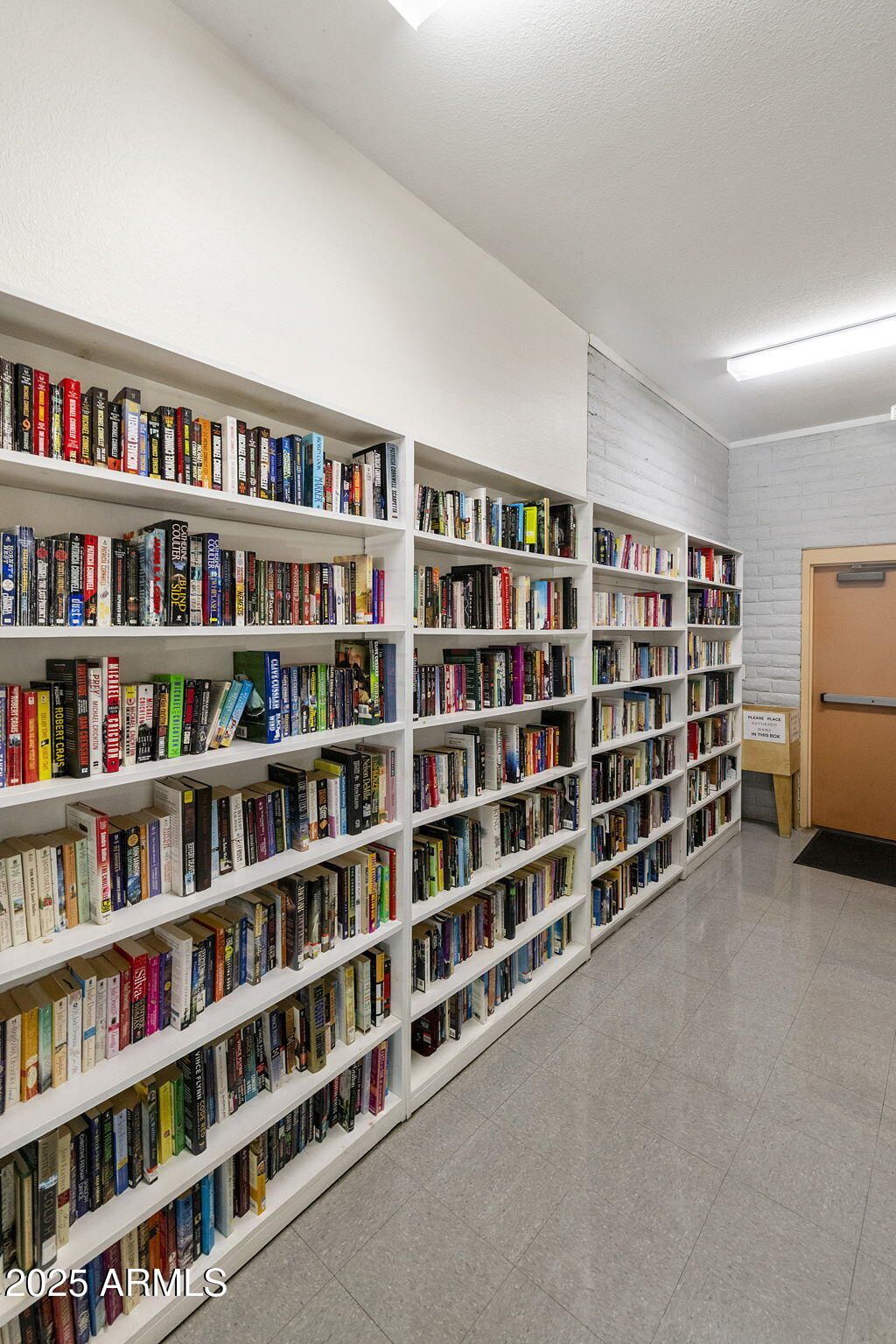 3700 South Tomahawk Road, Unit 80 Apache Junction, AZ 85119 - Photo 36 of 41 a view of an empty room with shelves