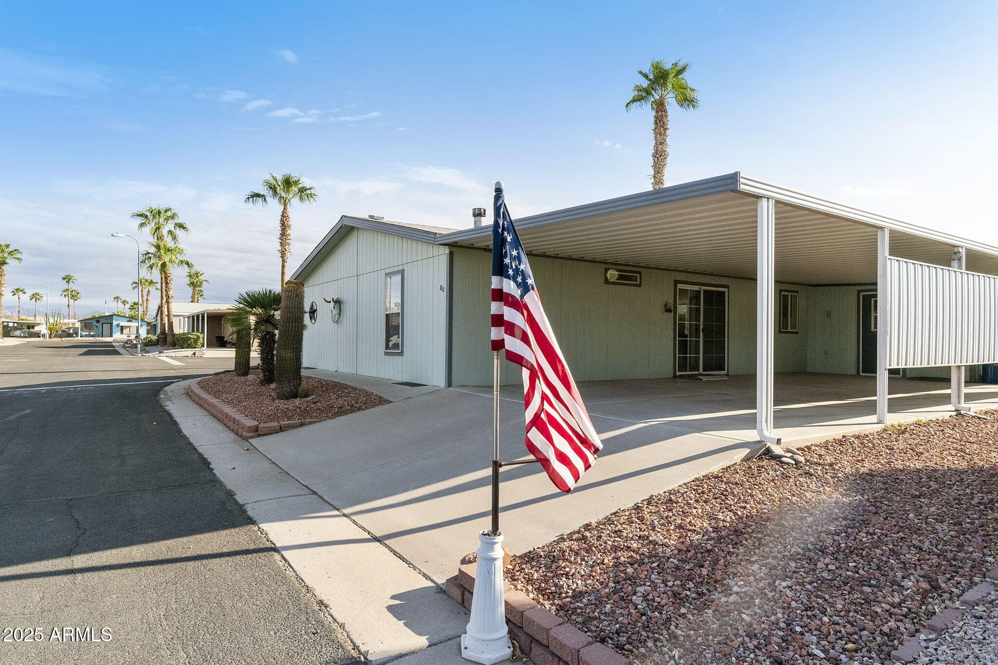 3700 South Tomahawk Road, Unit 80 Apache Junction, AZ 85119 - Photo 6 of 41 a front view of a house with entryway