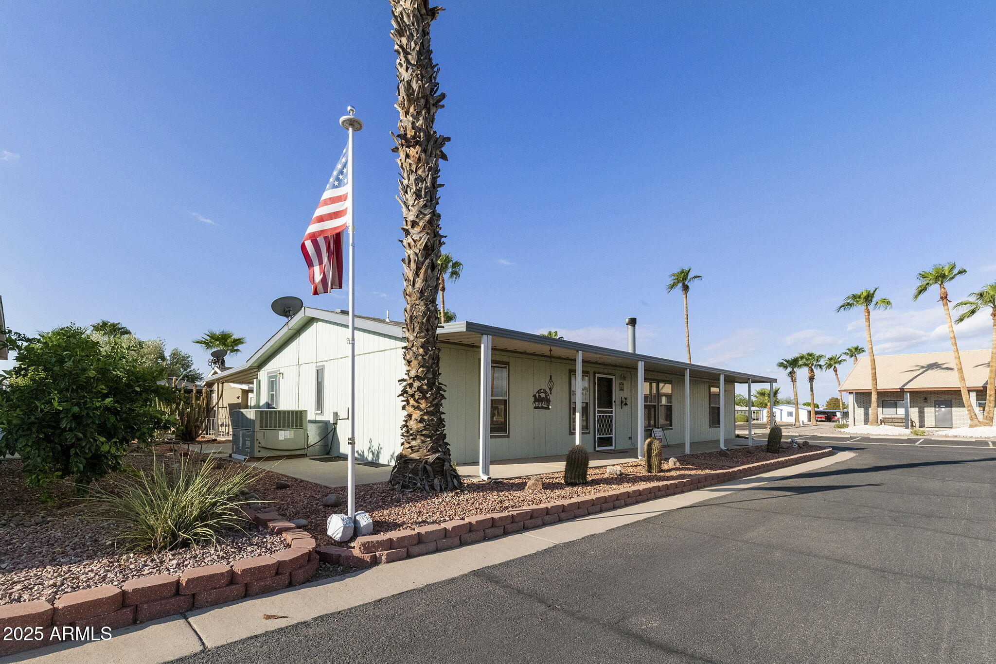 3700 South Tomahawk Road, Unit 80 Apache Junction, AZ 85119 - Photo 7 of 41 a view of a street with sitting area