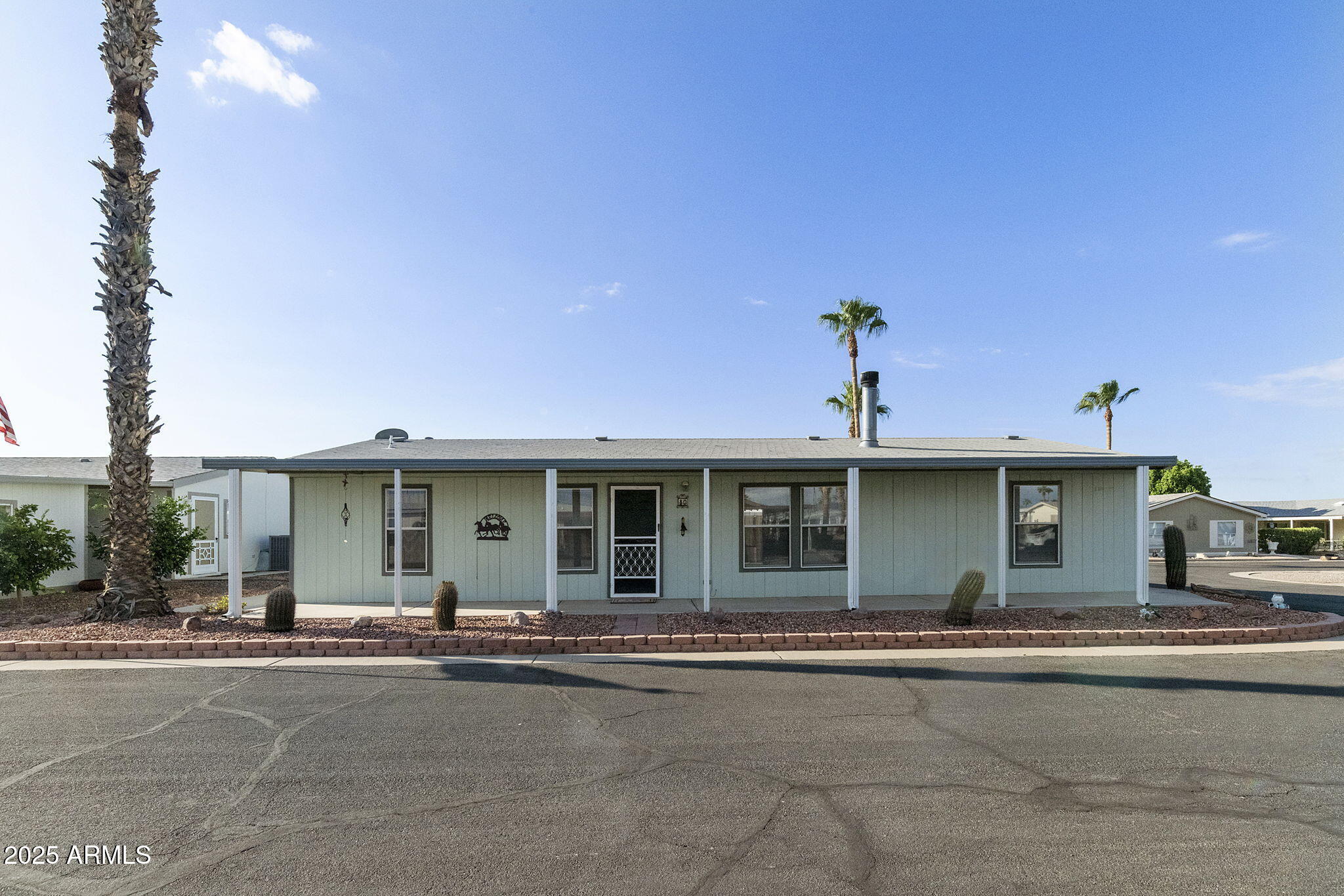 3700 South Tomahawk Road, Unit 80 Apache Junction, AZ 85119 - Photo 8 of 41 a view of a house with a yard