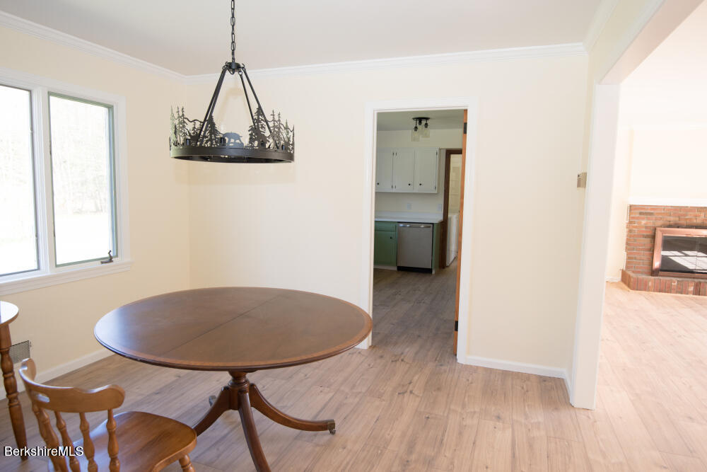 98 N Road Monroe, MA 01247 - Photo 11 of 32 a view of a dining room with furniture window and wooden floor