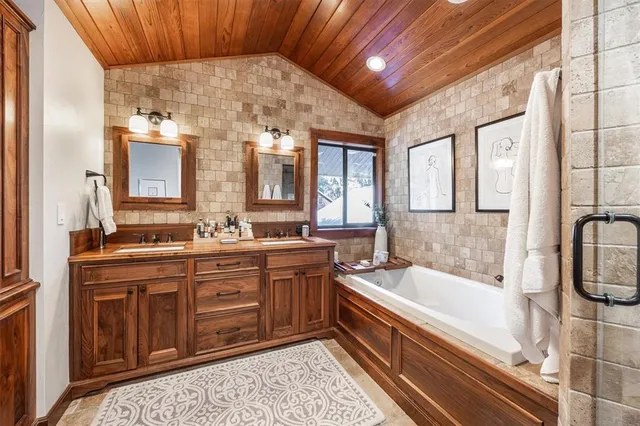 a view of a patio with couches table and chairs and potted plants