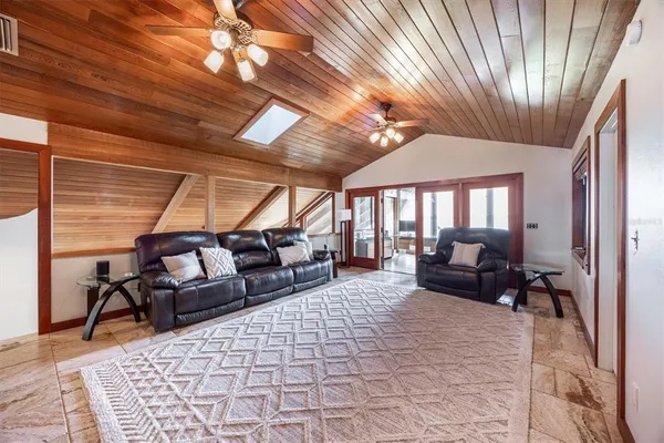 a bedroom with a bed and a lamp on table