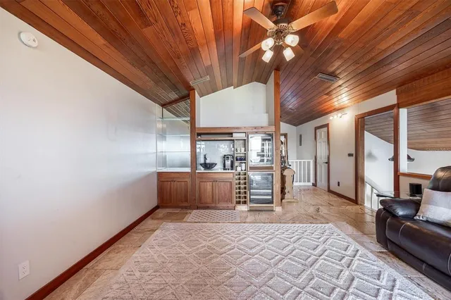 a bedroom with a bed and a lamp on table