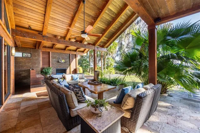 a view of a swimming pool with a patio and a yard