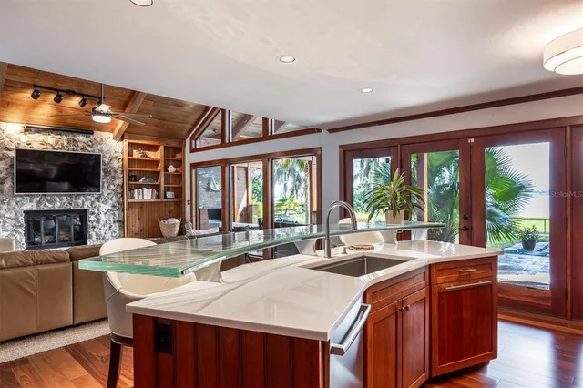 a view of a livingroom with furniture wooden floor and a window