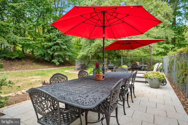 an outdoor space with furniture and umbrella