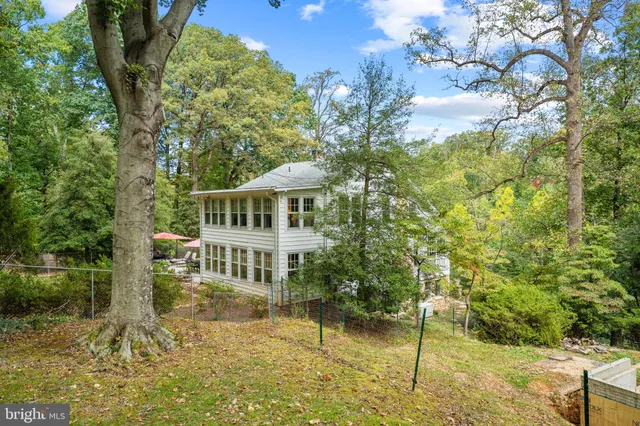 a house with swimming pool in front of it