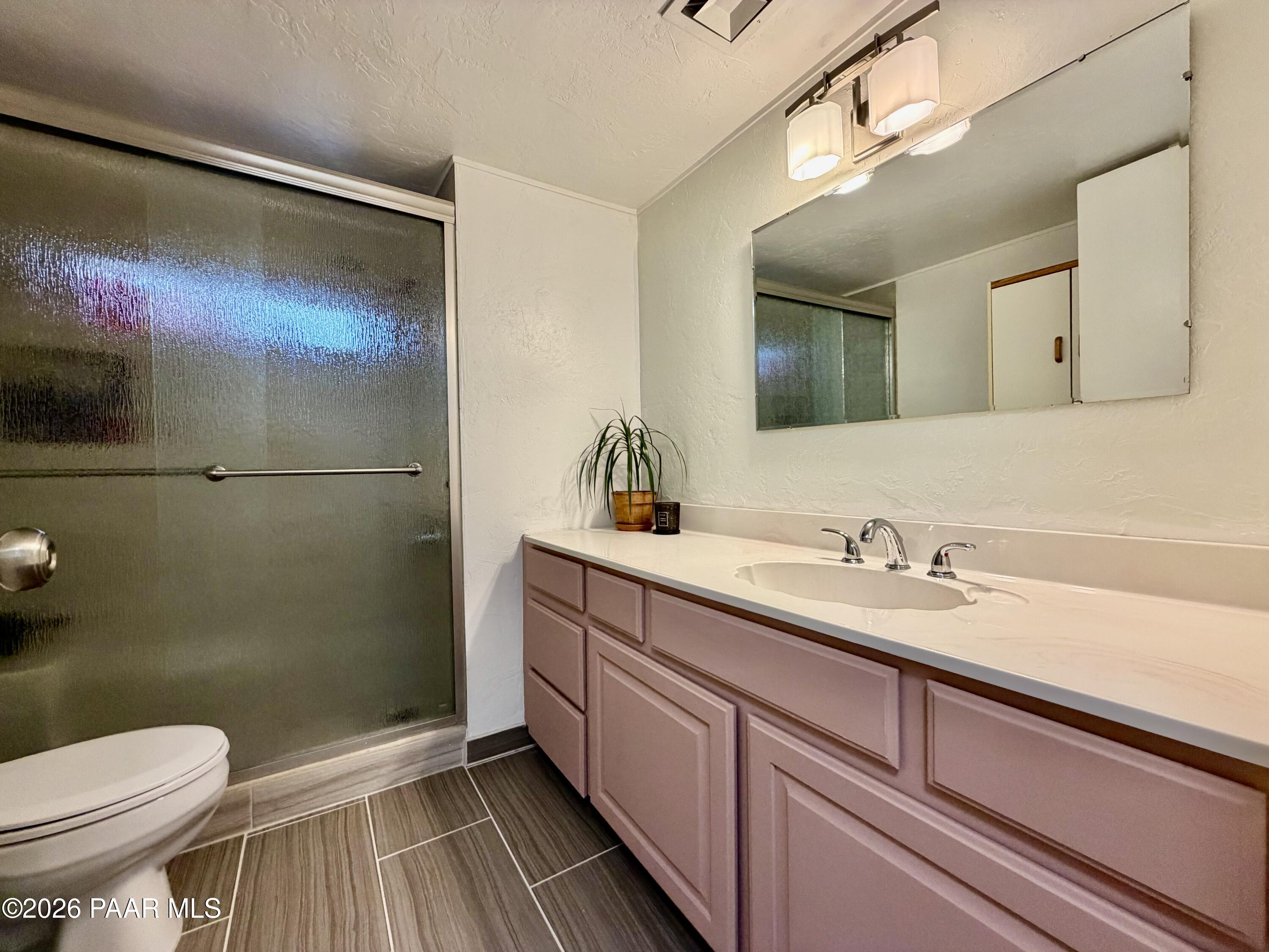 837 Division Street, Unit 32 Prescott, AZ 86301 - Photo 12 of 21 a bathroom with a sink a toilet and shower
