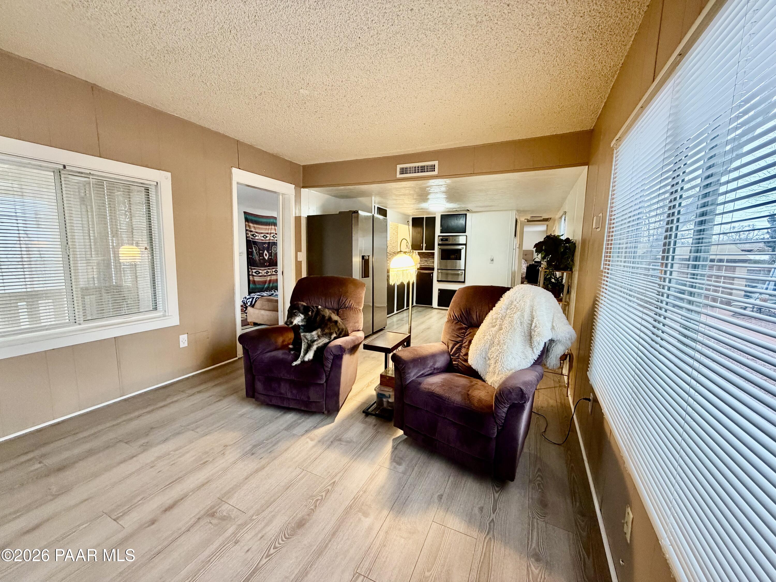 837 Division Street, Unit 32 Prescott, AZ 86301 - Photo 4 of 21 a living room with furniture and a wooden floor