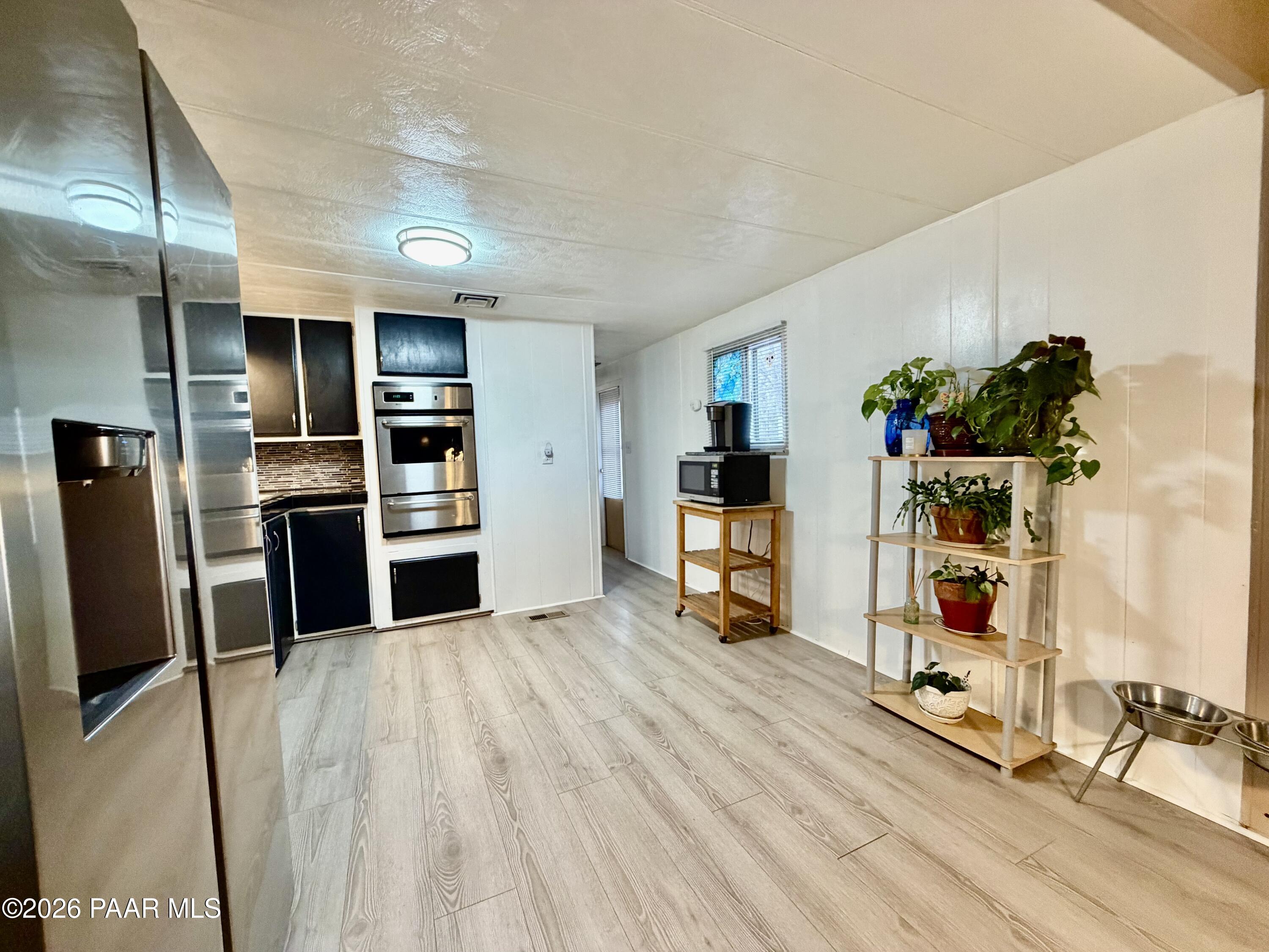 837 Division Street, Unit 32 Prescott, AZ 86301 - Photo 7 of 21 a view of a living room with furniture and a flat screen tv