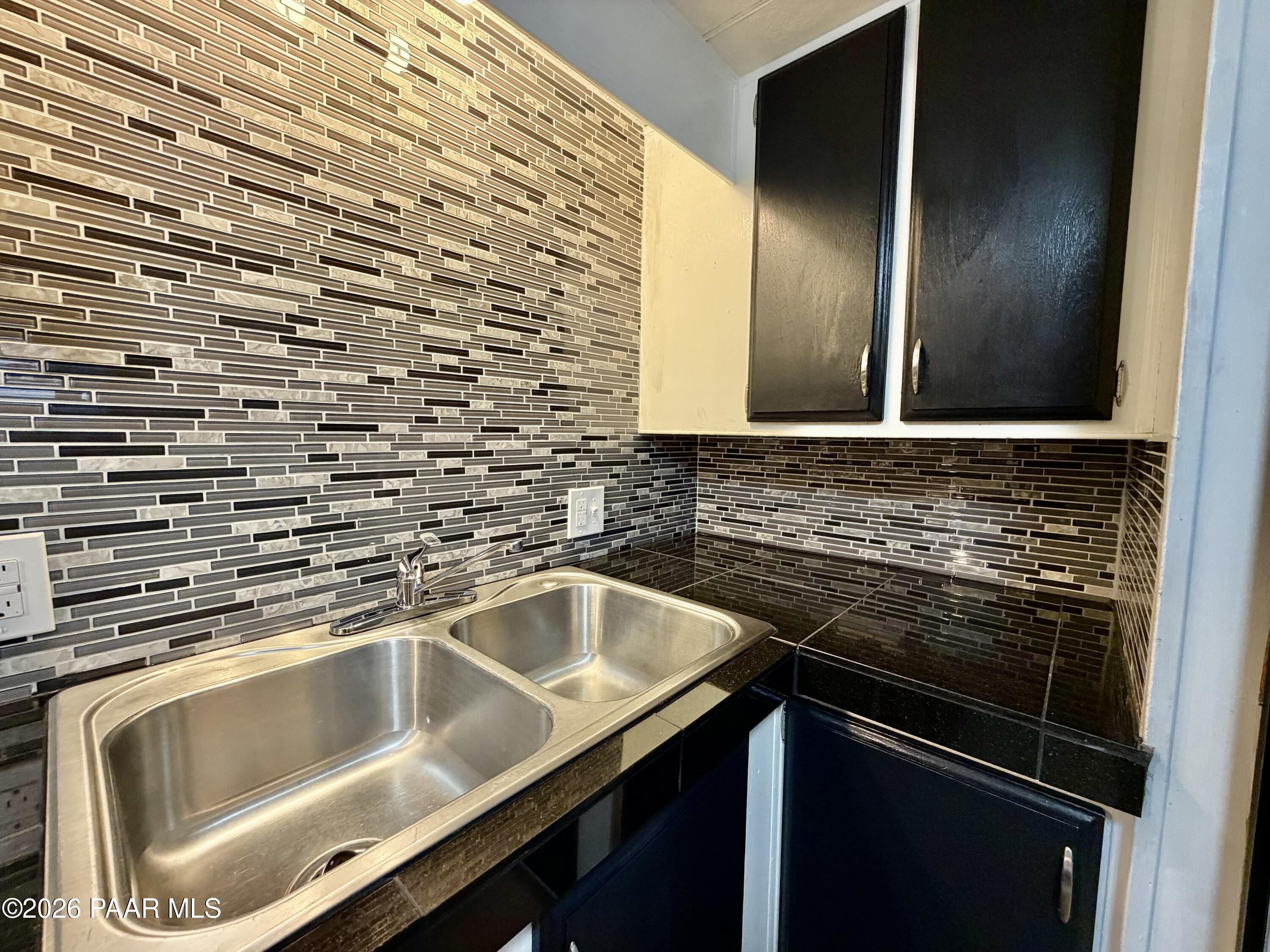 837 Division Street, Unit 32 Prescott, AZ 86301 - Photo 8 of 21 a kitchen with a sink and cabinets