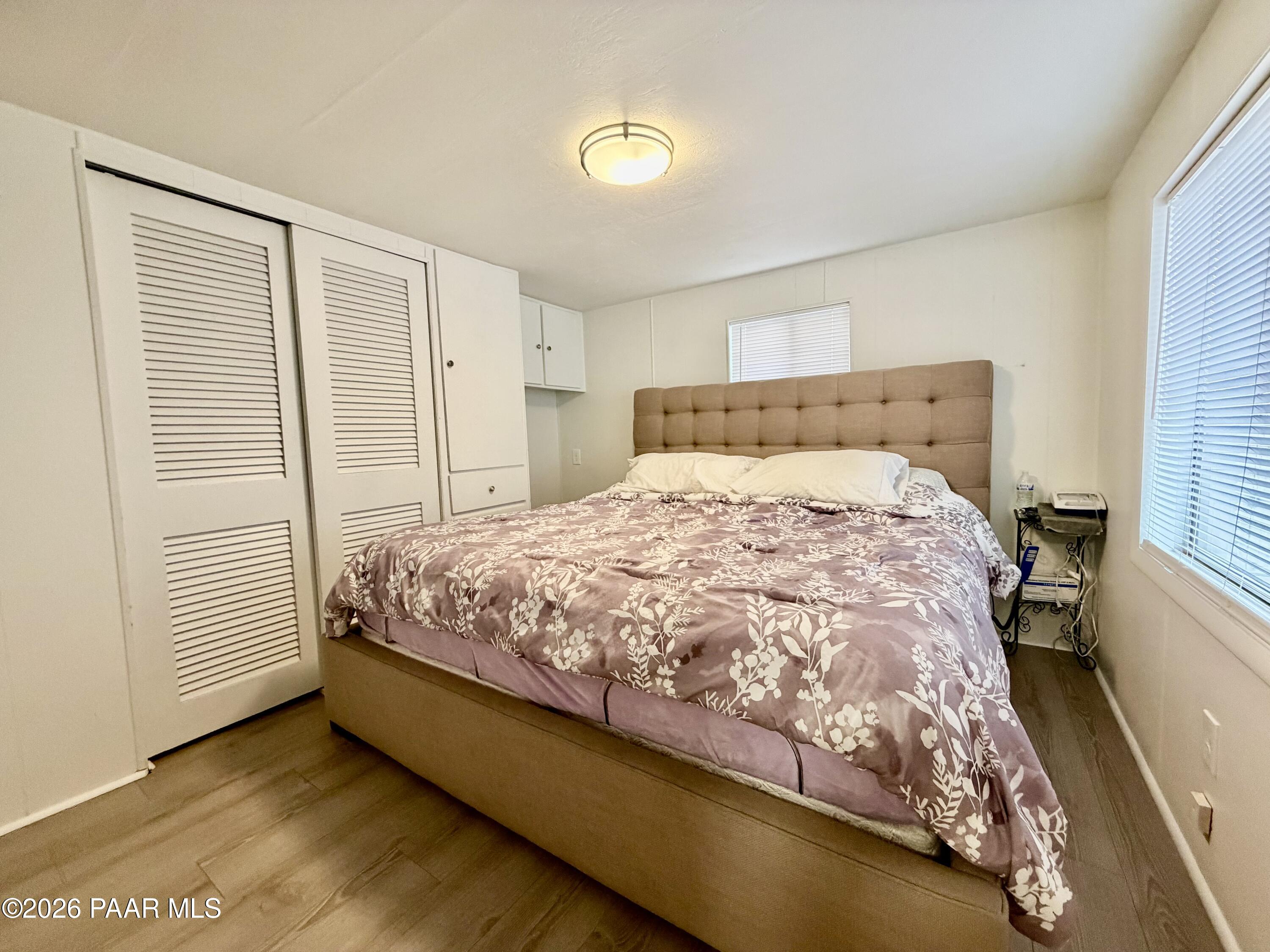 837 Division Street, Unit 32 Prescott, AZ 86301 - Photo 9 of 21 a bed sitting in a bedroom next to a window