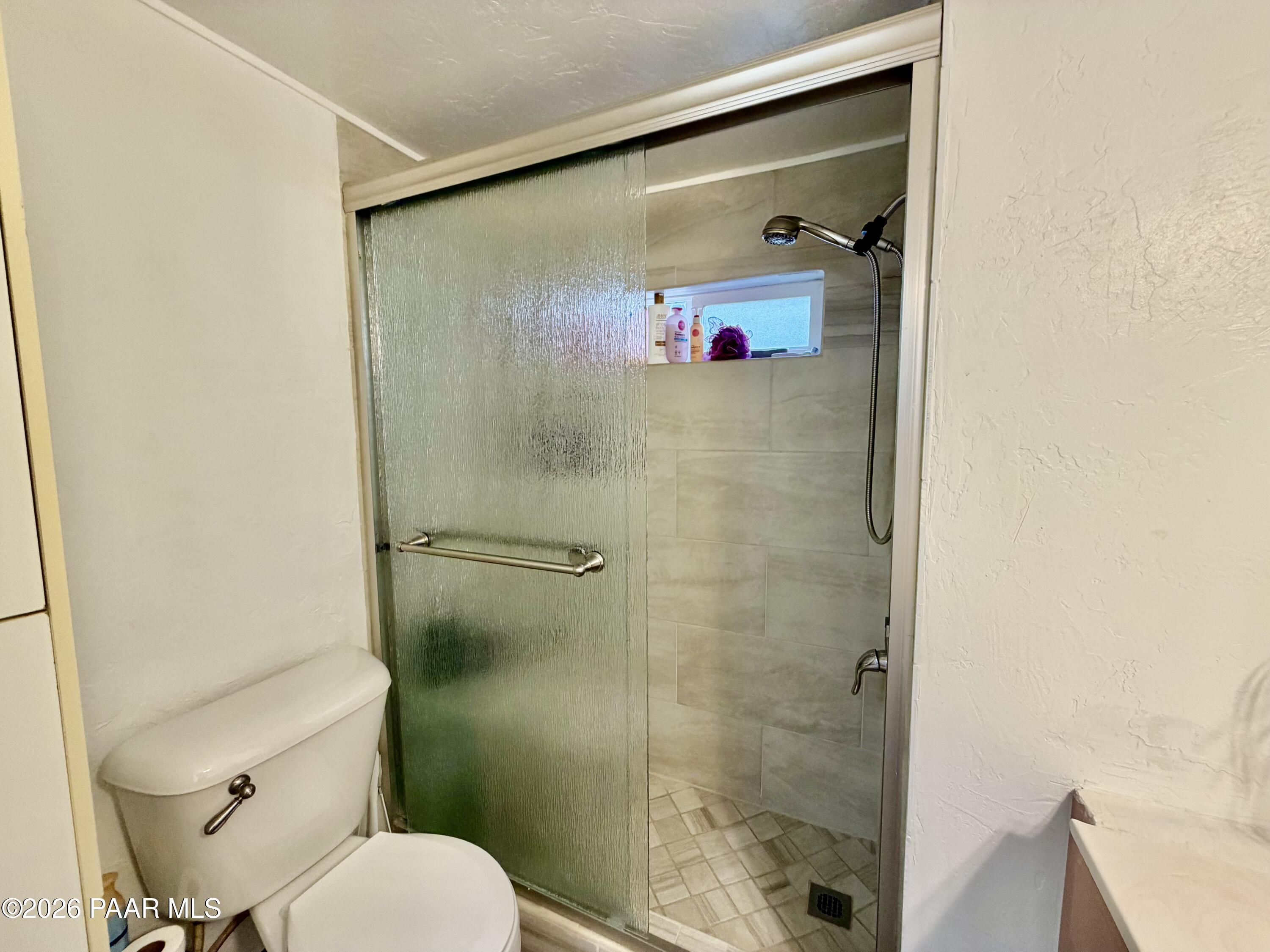 837 Division Street, Unit 32 Prescott, AZ 86301 - Photo 10 of 21 a bathroom with a shower and toilet