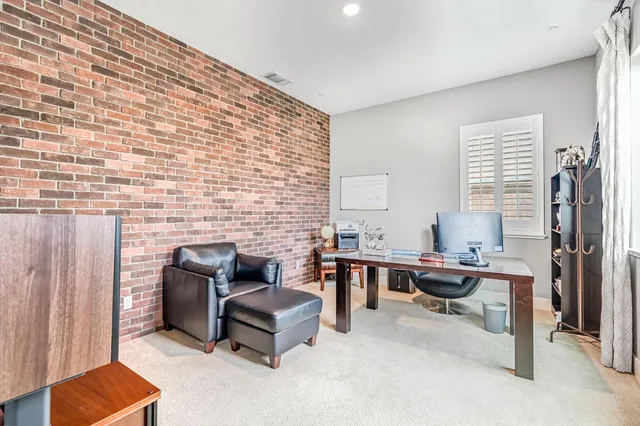 a workspace with furniture and a window