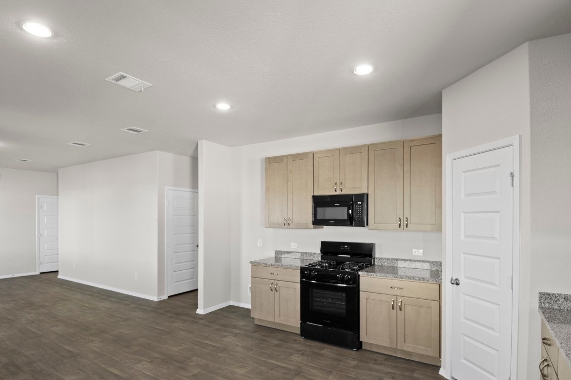 108 Summer Drive Elgin, TX 78621 - Photo 21 of 35 a kitchen with a sink and stainless steel appliances