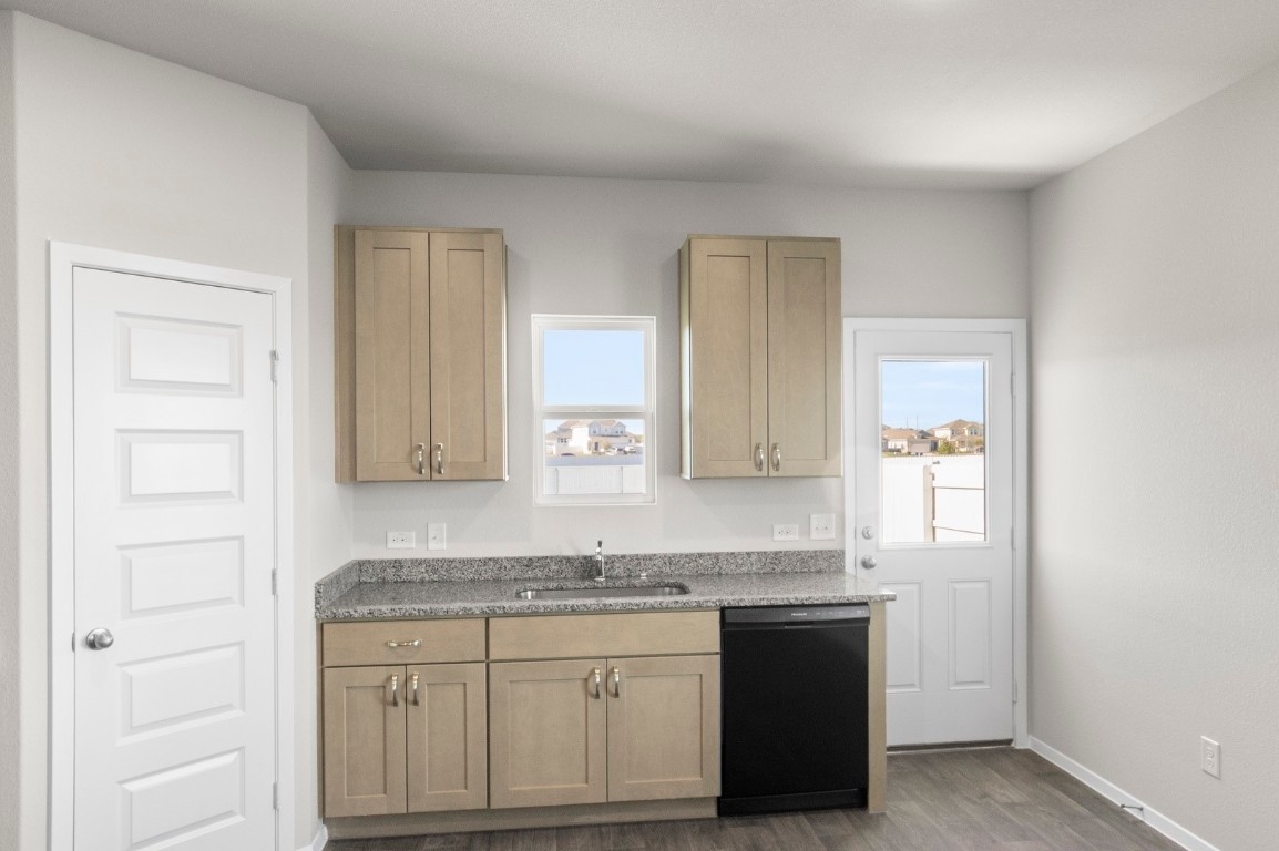 108 Summer Drive Elgin, TX 78621 - Photo 23 of 35 a bathroom with a granite countertop sink and a mirror