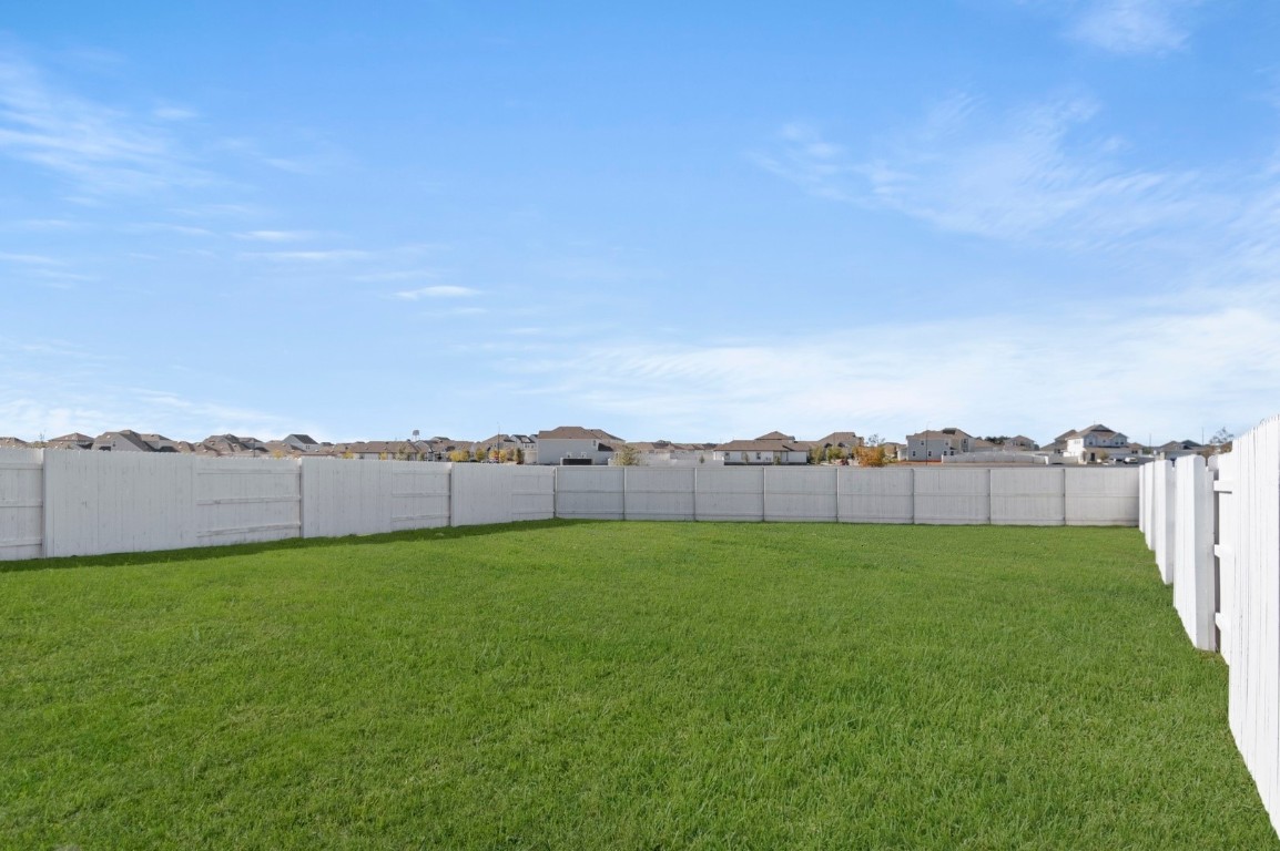 108 Summer Drive Elgin, TX 78621 - Photo 34 of 35 a view of an outdoor space and a yard