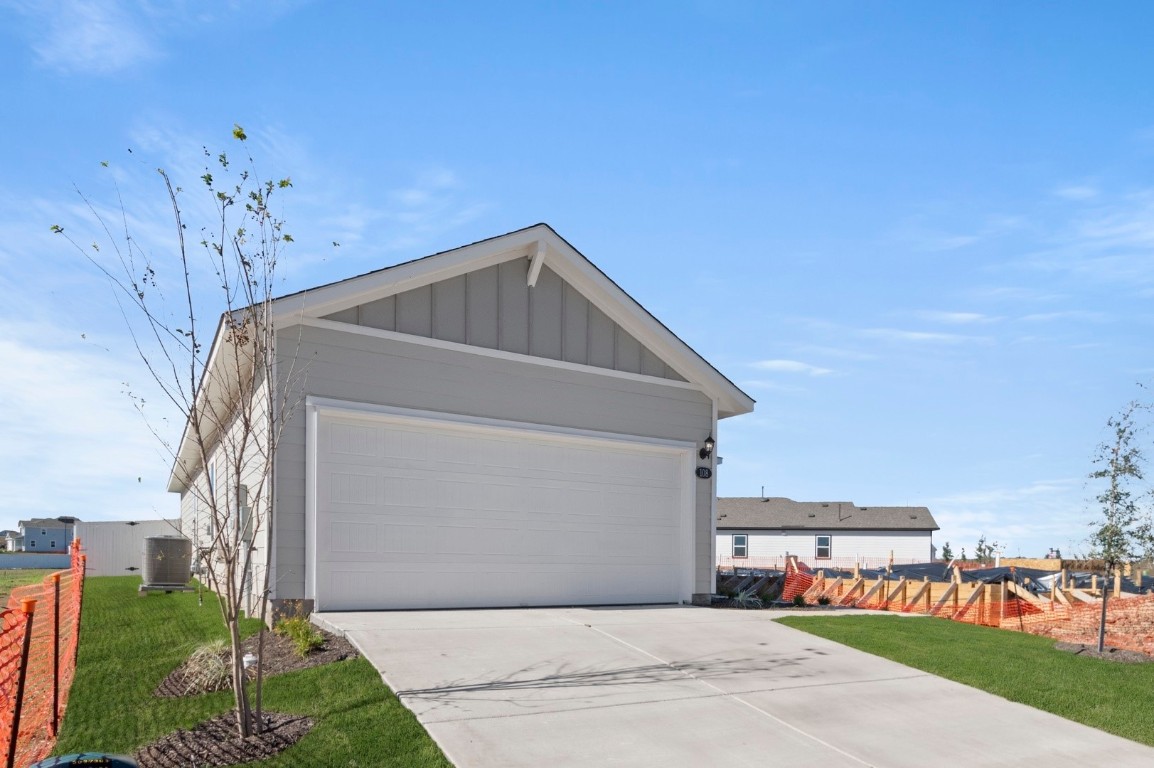 108 Summer Drive Elgin, TX 78621 - Photo 8 of 35 a front view of a house with a yard
