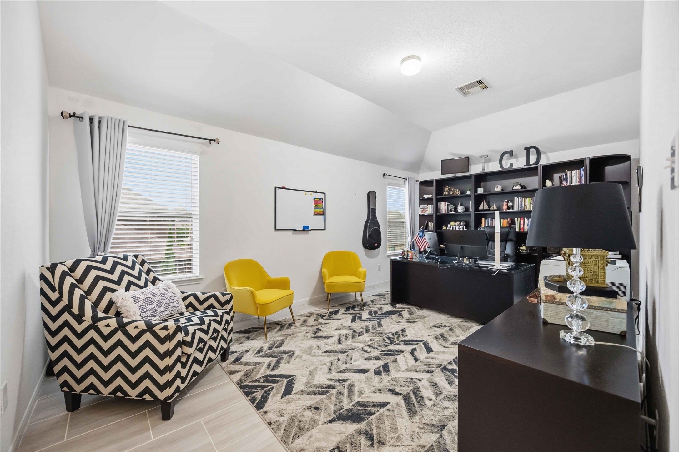 2139 Pacific Loon Lane Conroe, TX 77385 - Photo 15 of 21 Spacious flex room currently utilized as a home office, perfect for remote work, a game room, media space, or additional lounge area. Features an open layout with abundant natural light and endless possibilities.