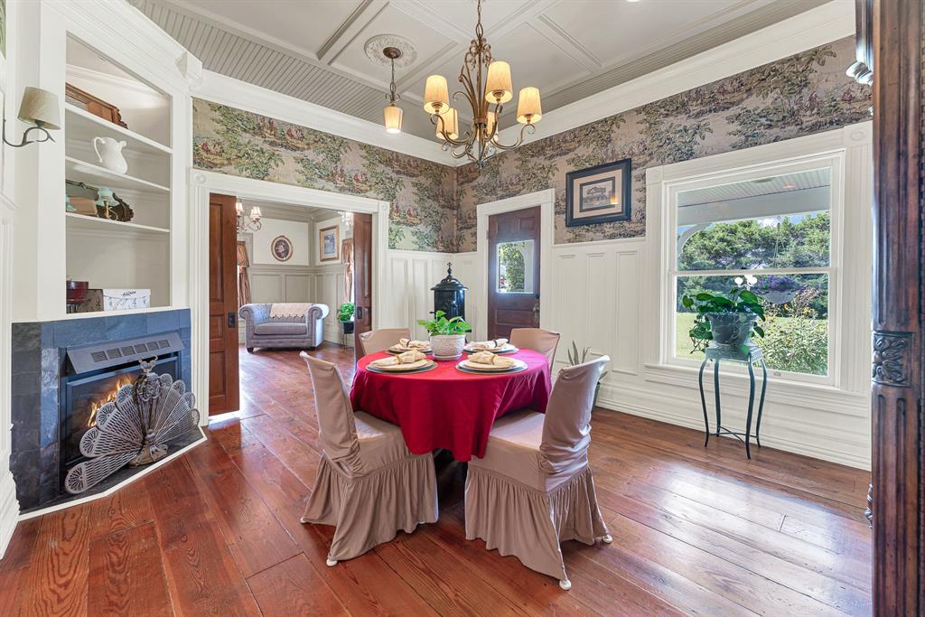 1425 Lone Star Road Celina, TX 75009 - Photo 8 of 40 Detailed millwork, oversized windows, and carefully recreated Victorian craftsmanship give the dining room a warm, timeless elegance. Holiday celebrations, family dinners, and milestone moments all feel right at home here.
