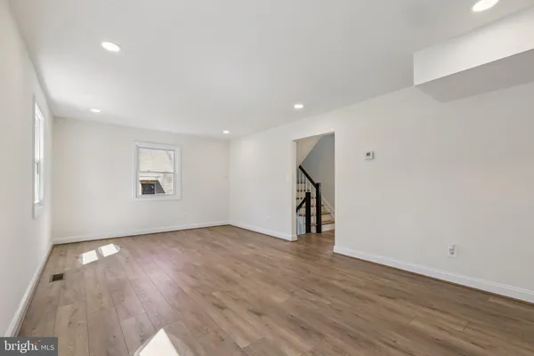 an empty room with wooden floor