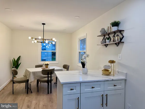 a dining room with a table and chairs