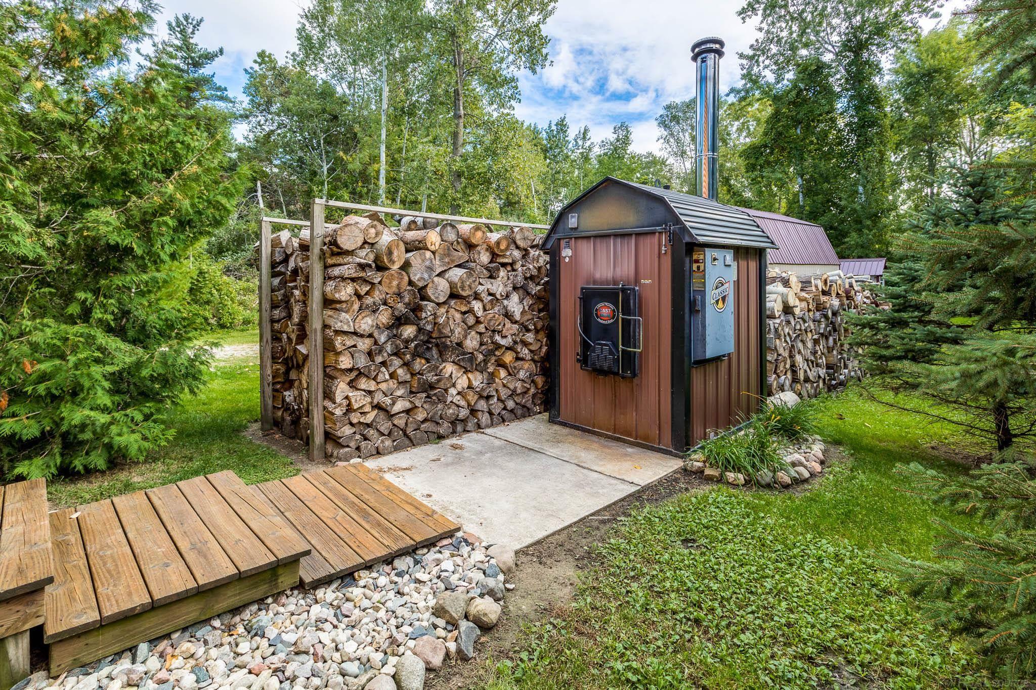 3279 Babcock Road Lexington, MI 48450 - Photo 57 of 67 Outdoor Wood Boiler with Propane Option