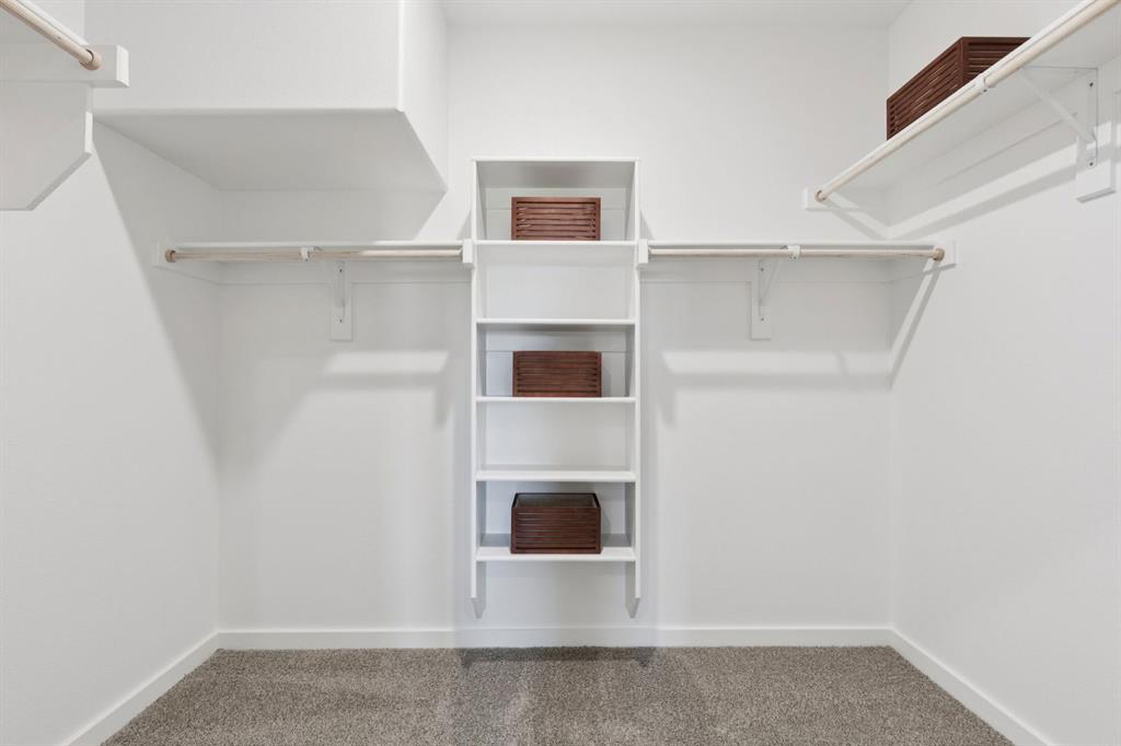 1855 Balfour Bend Forney, TX 75126 - Photo 17 of 28 Primary Closet in the Magnolia home plan by Trophy Signature Homes – REPRESENTATIVE PHOTO