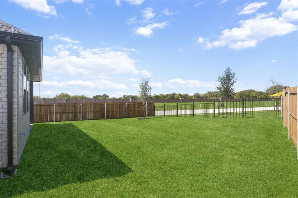 1855 Balfour Bend Forney, TX 75126 - Photo 27 of 28 Backyard in the Magnolia home plan by Trophy Signature Homes – REPRESENTATIVE PHOTO