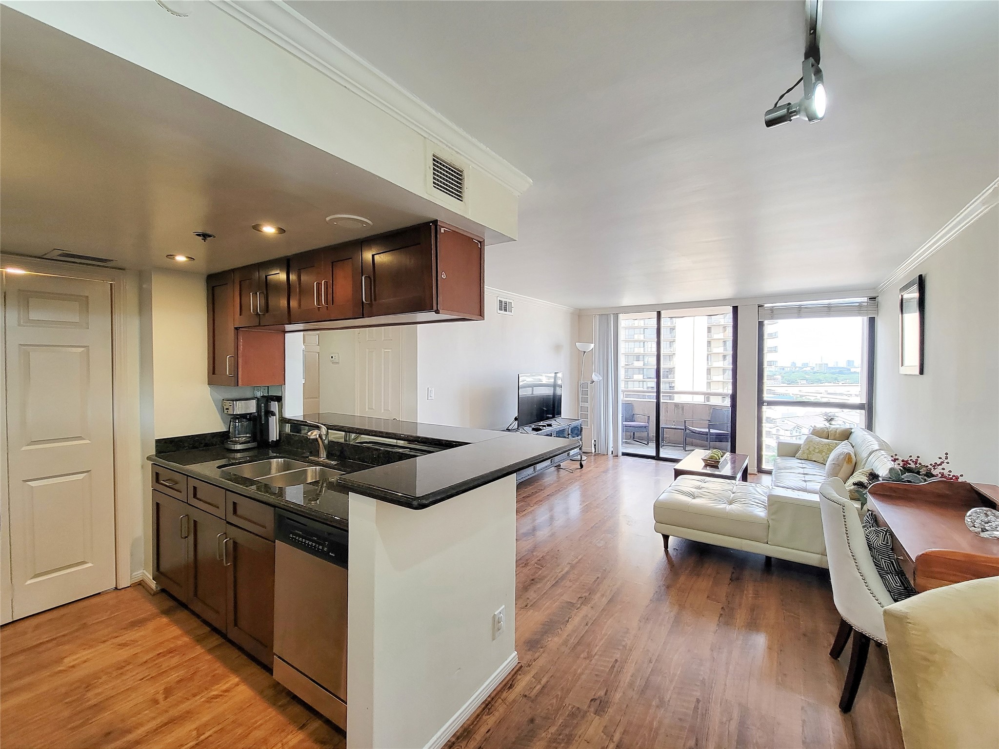 3525 Sage Road, Unit 1605 Houston, TX 77056 - Photo 7 of 33 a kitchen with stainless steel appliances a stove a sink a refrigerator and couches