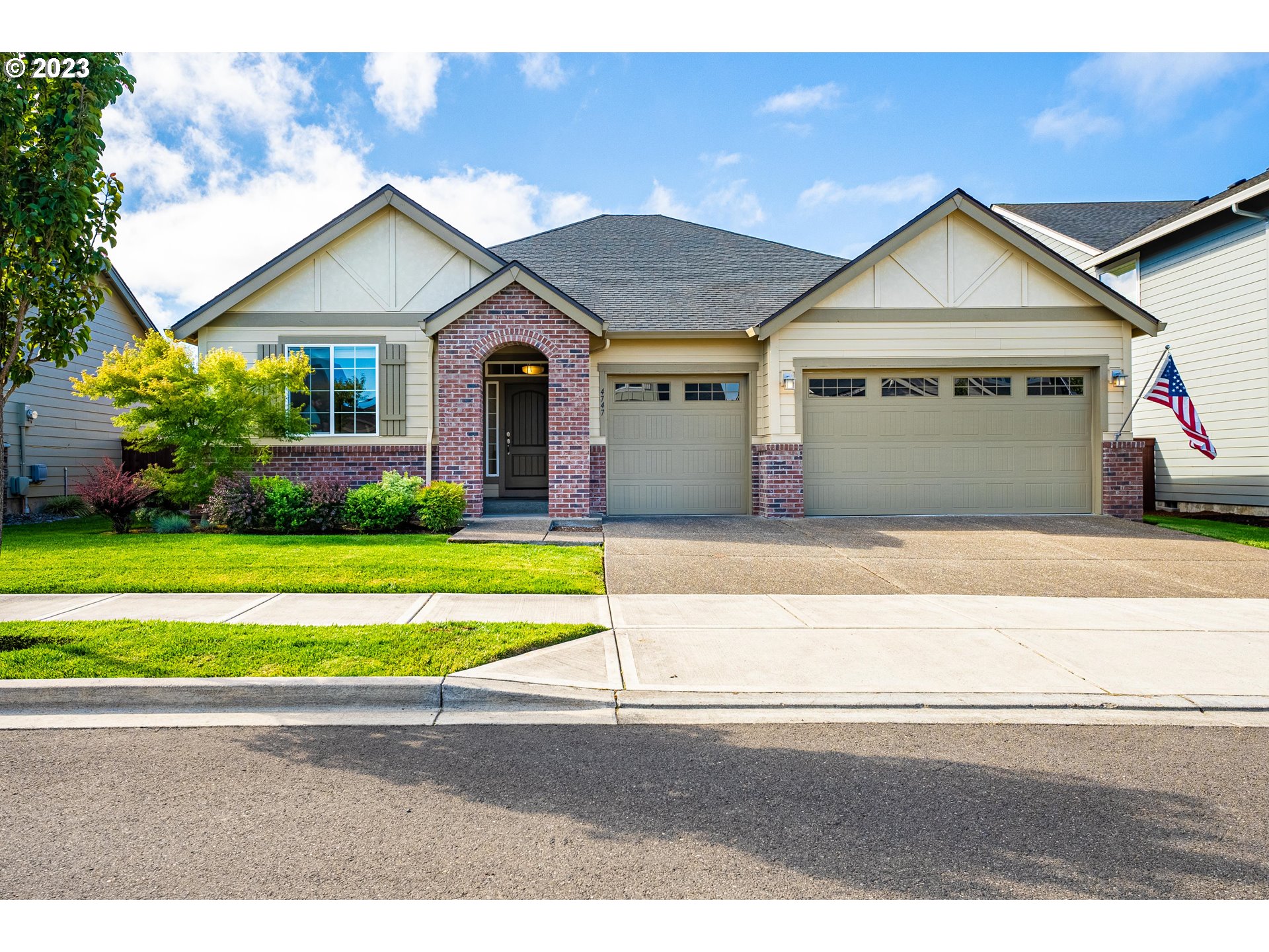 4747 South 18th Drive Ridgefield, WA 98642 - Photo 1 of 39 a front view of a house with a yard and garage