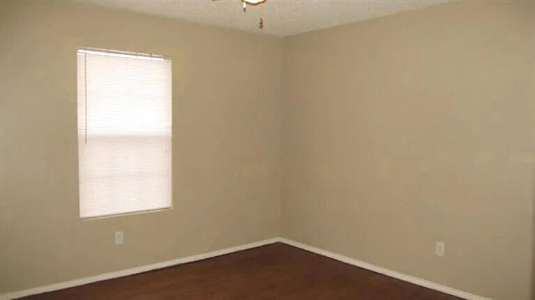914 82nd Street, Unit B Lubbock, TX 79423 - Photo 2 of 8 an empty room with a window
