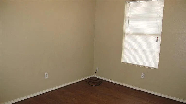 914 82nd Street, Unit B Lubbock, TX 79423 - Photo 6 of 8 an empty room with a window