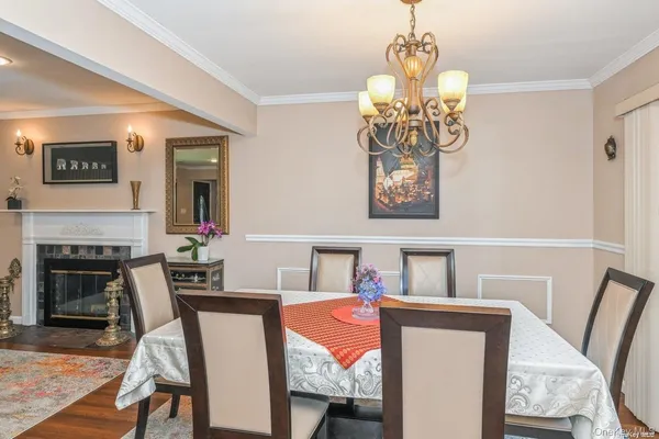 a dining room with furniture and fireplace