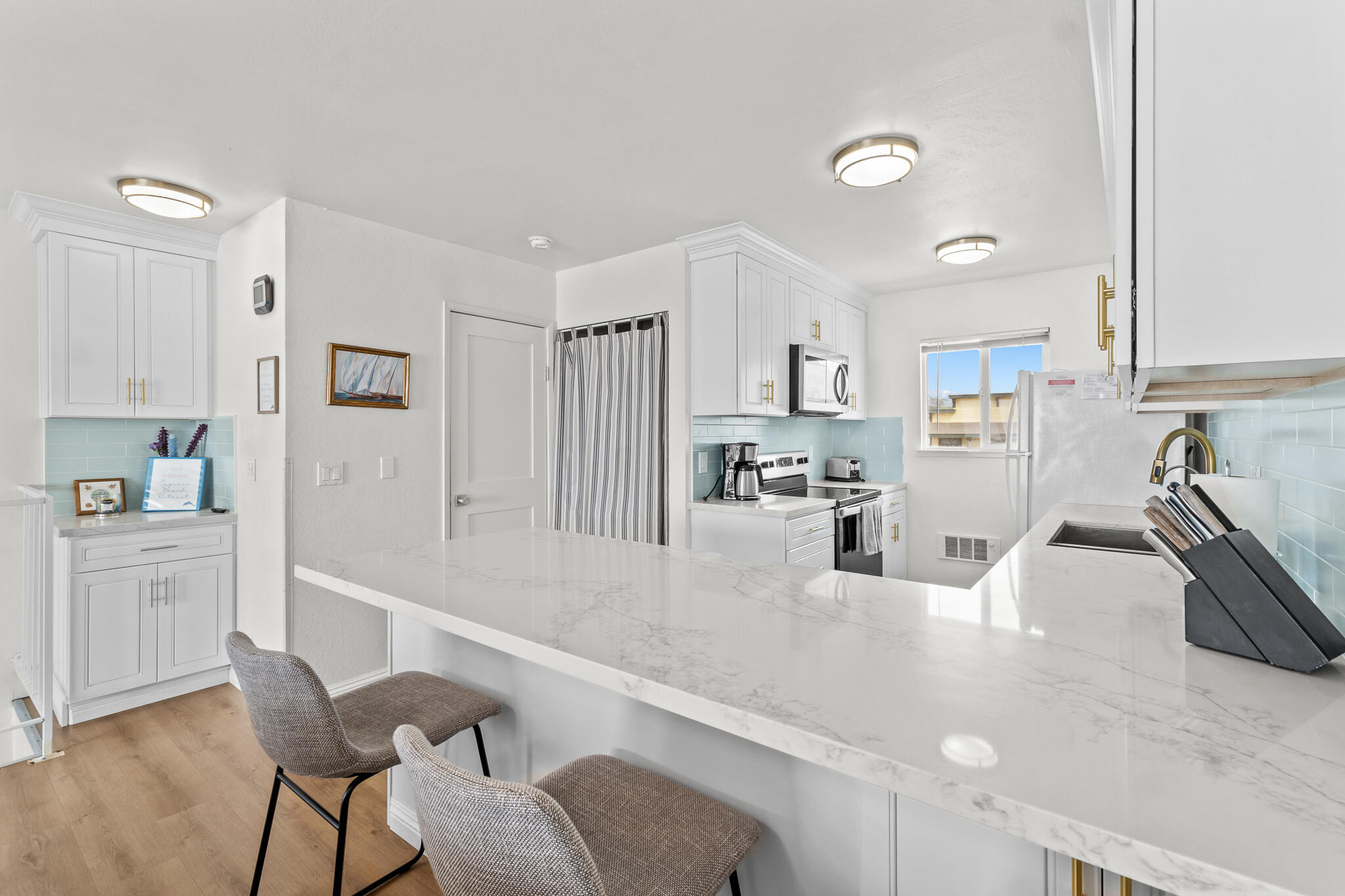 77 North Ocean Avenue, Unit 12 Cayucos, CA 93430 - Photo 10 of 41 a kitchen with granite countertop a sink cabinets and stainless steel appliances