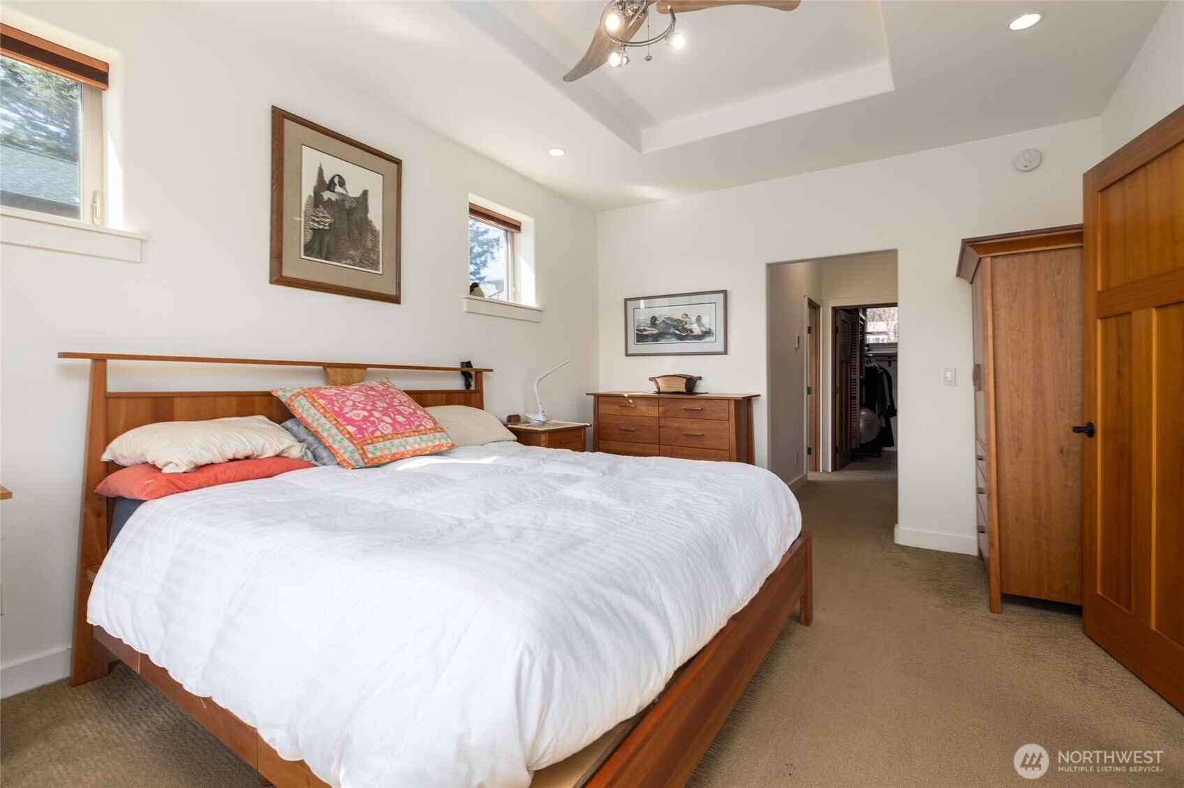 13207 Satterlee Road Anacortes, WA 98221 - Photo 17 of 40 a bedroom with bed and cupboard