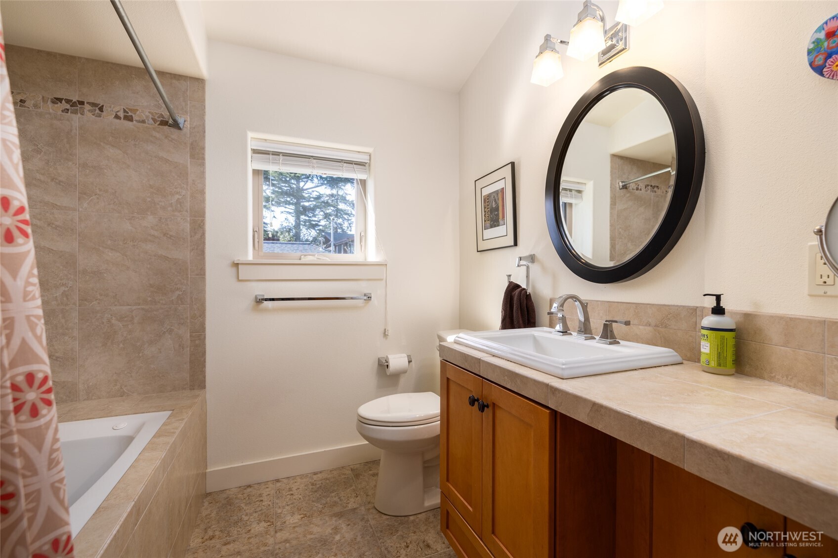 13207 Satterlee Road Anacortes, WA 98221 - Photo 30 of 40 a bathroom with a granite countertop toilet a sink and a bathtub