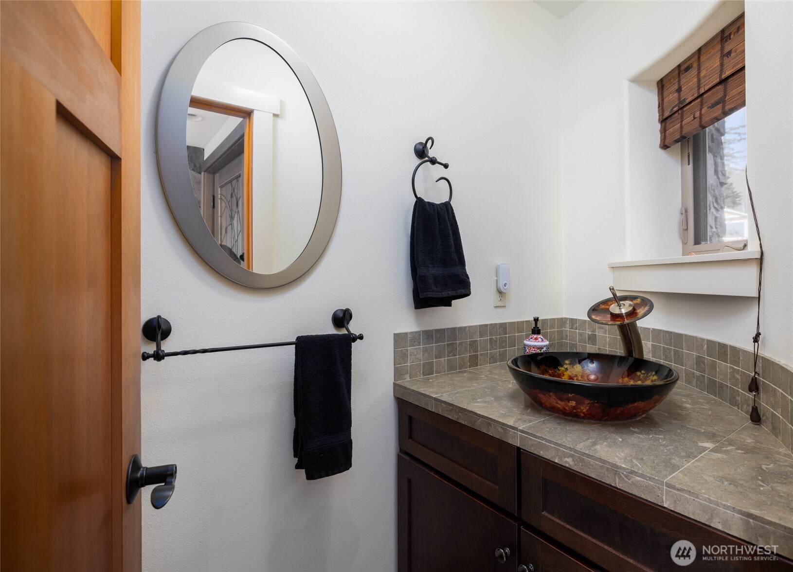 13207 Satterlee Road Anacortes, WA 98221 - Photo 31 of 40 a kitchen with a sink and a mirror