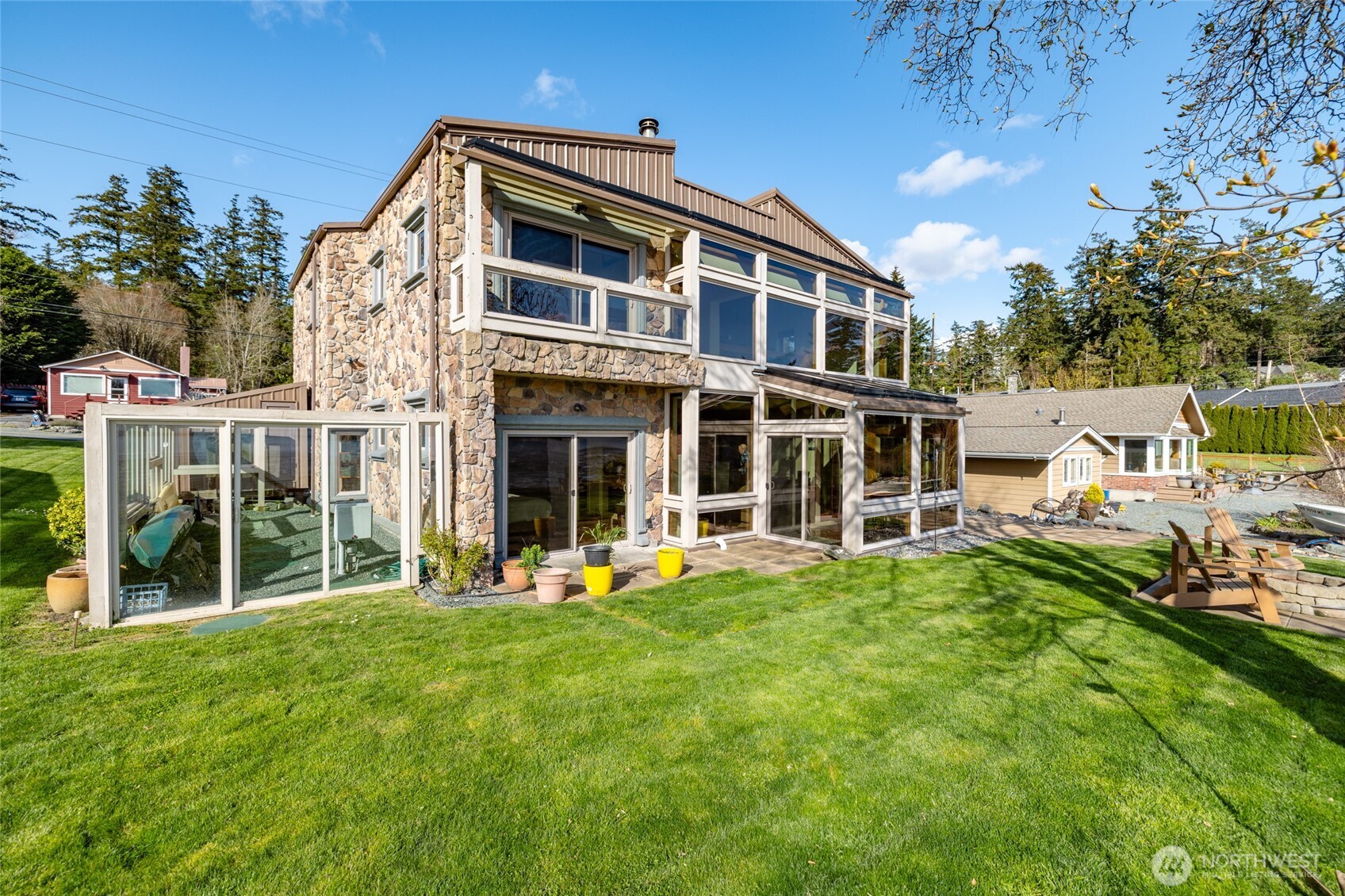 13207 Satterlee Road Anacortes, WA 98221 - Photo 34 of 40 a front view of a building with a yard