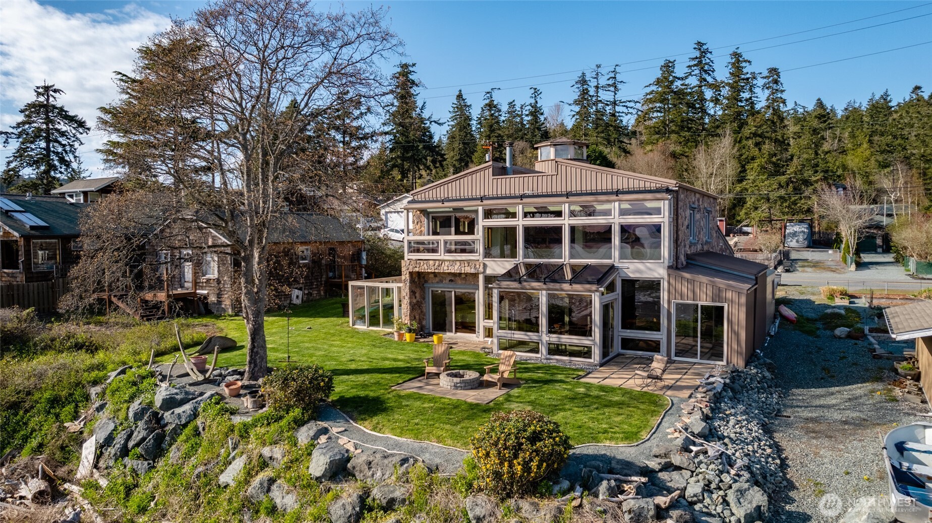 13207 Satterlee Road Anacortes, WA 98221 - Photo 37 of 40 a front view of a house with a yard table and chairs