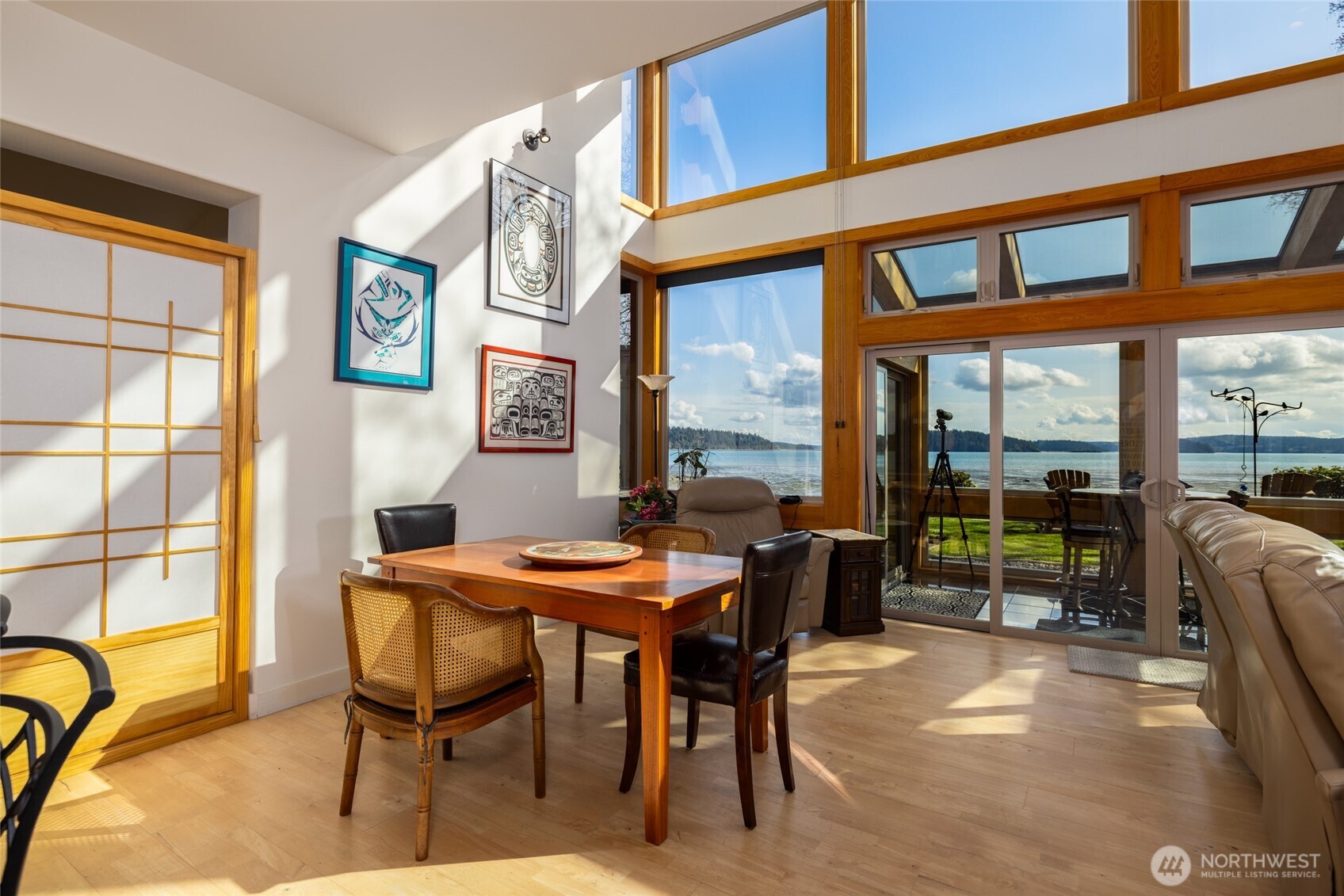 13207 Satterlee Road Anacortes, WA 98221 - Photo 6 of 40 a dining room with furniture and a floor to ceiling window