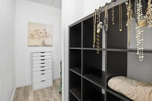 a bathroom with a granite countertop sink and a toilet